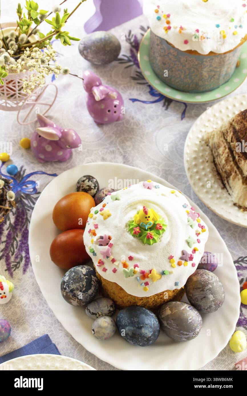 Festive Easter table setting. Easter orthodox cakes with Easter eggs Stock Photo