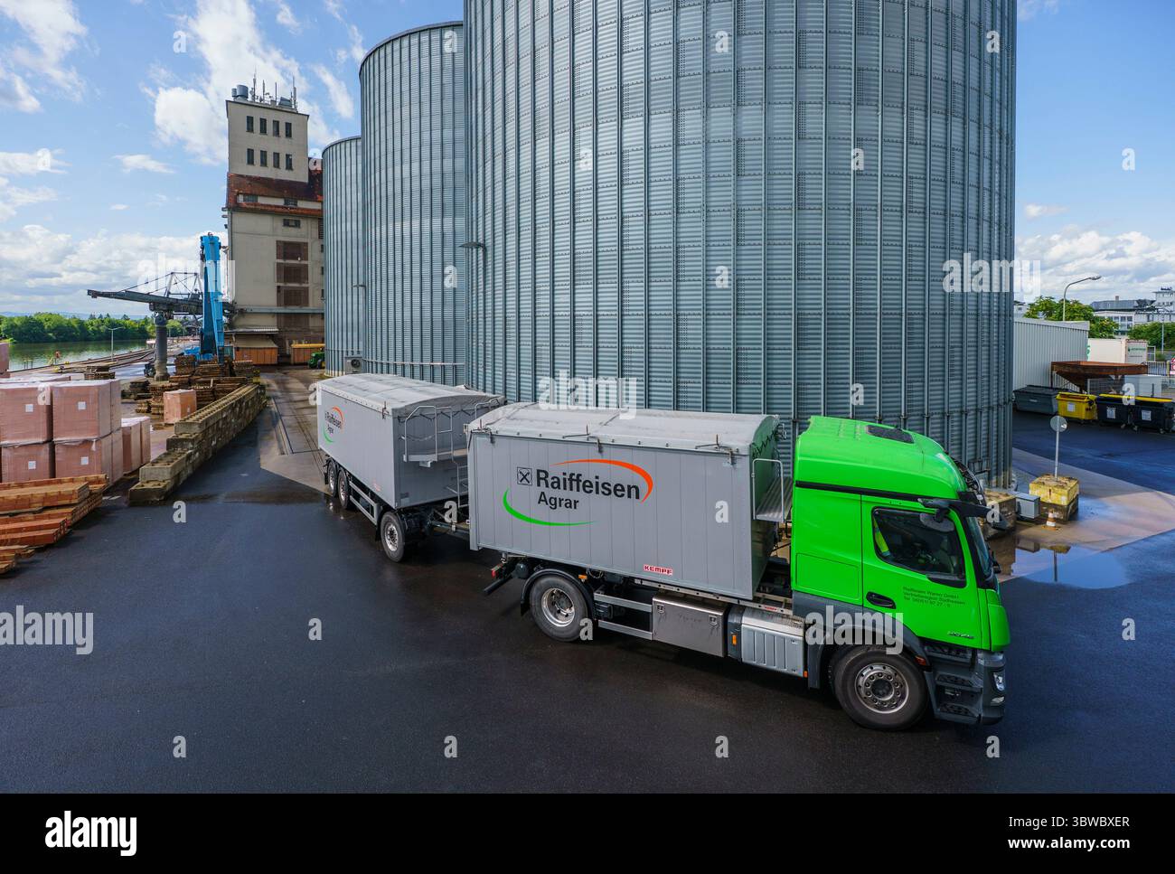 Hanau, Germany. 16th July, 2025. A grain truck leaves the depot after unloading. Raiffeisen Waren GmbH operates a grain warehouse at Hanau harbor, the largest of its kind in Hesse. Thanks to