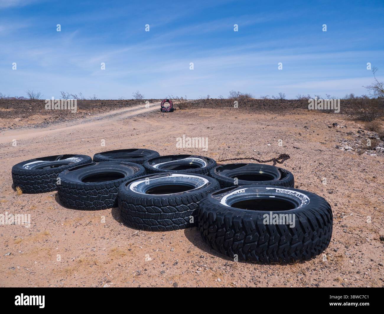 Border Patrol tires used to smooth roadway, El Camino del Diablo, Arizona. Stock Photo