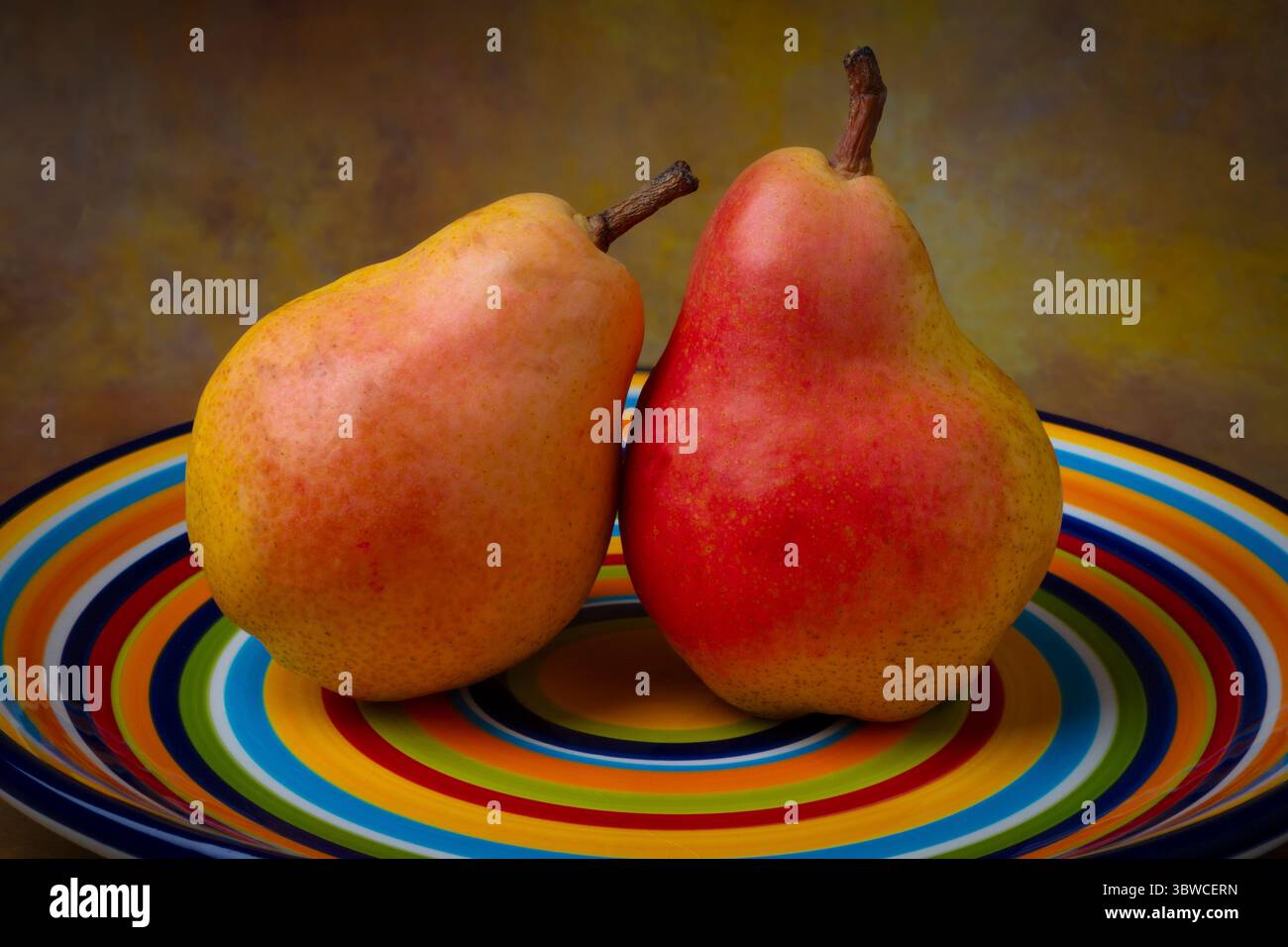 Delicious Pears On Colorful Plate Still life Stock Photo