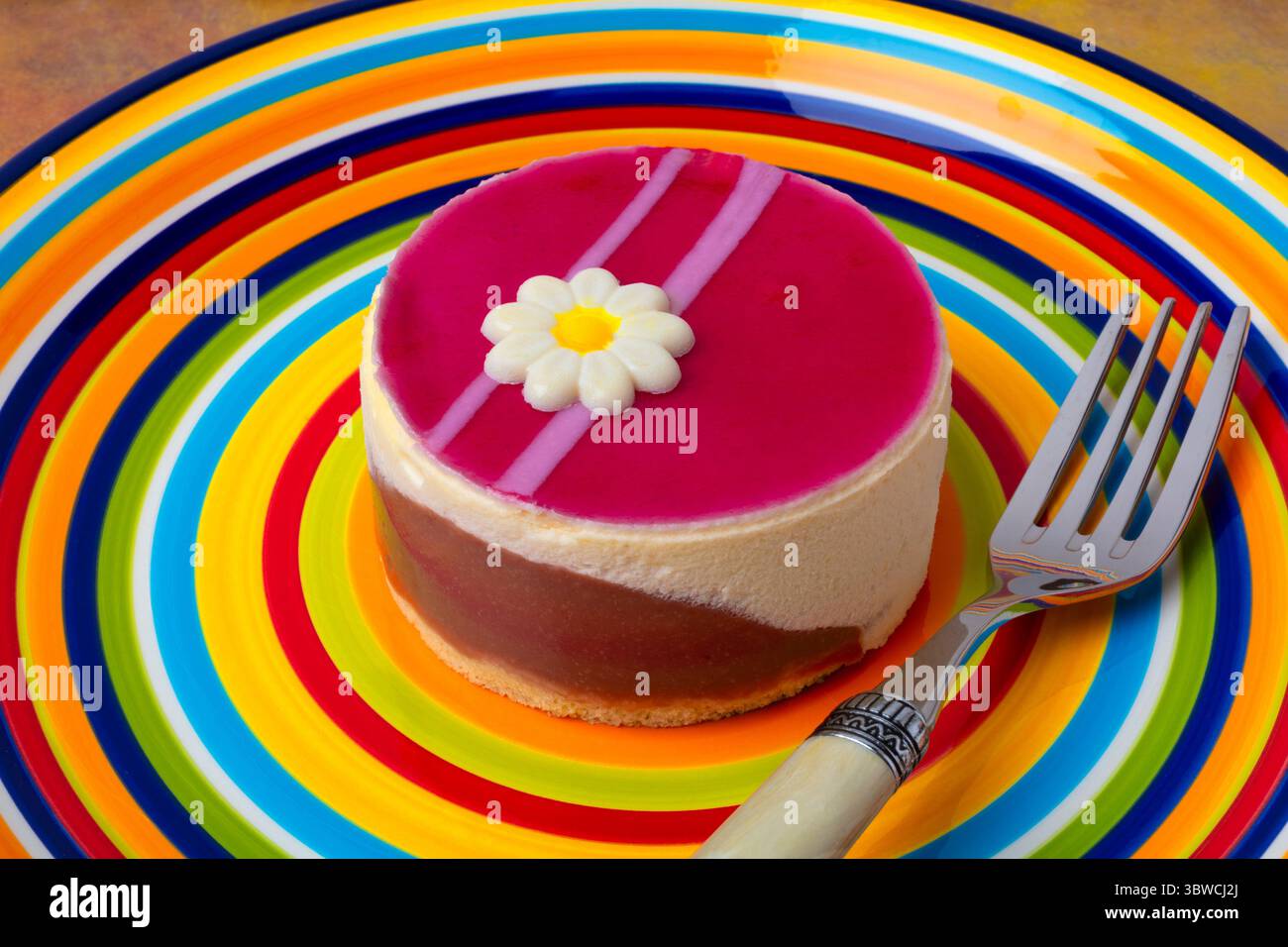 Raspberry Macarpone Cake On Colorful Plate With Fork Still life Stock Photo