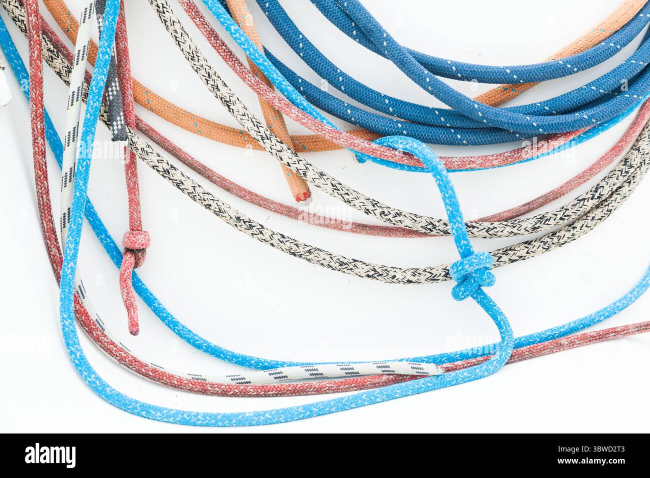 Multicolored ropes on a white background close-up. Stock Photo