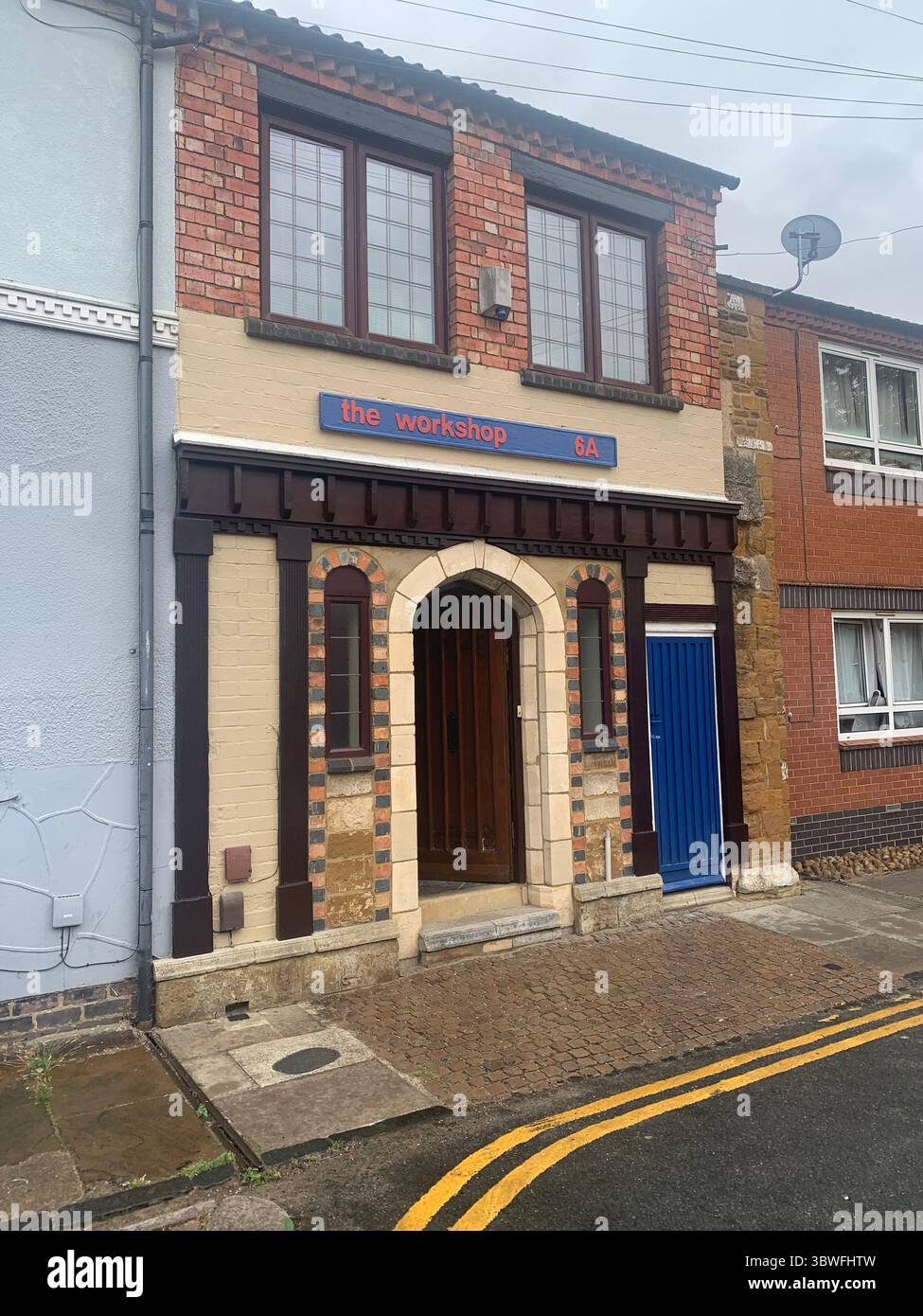 old quirky house in Northampton England UK British Victorian gothic style residence arch arched arches front door sign vintage building home look - Smartphone Captured Stock Image