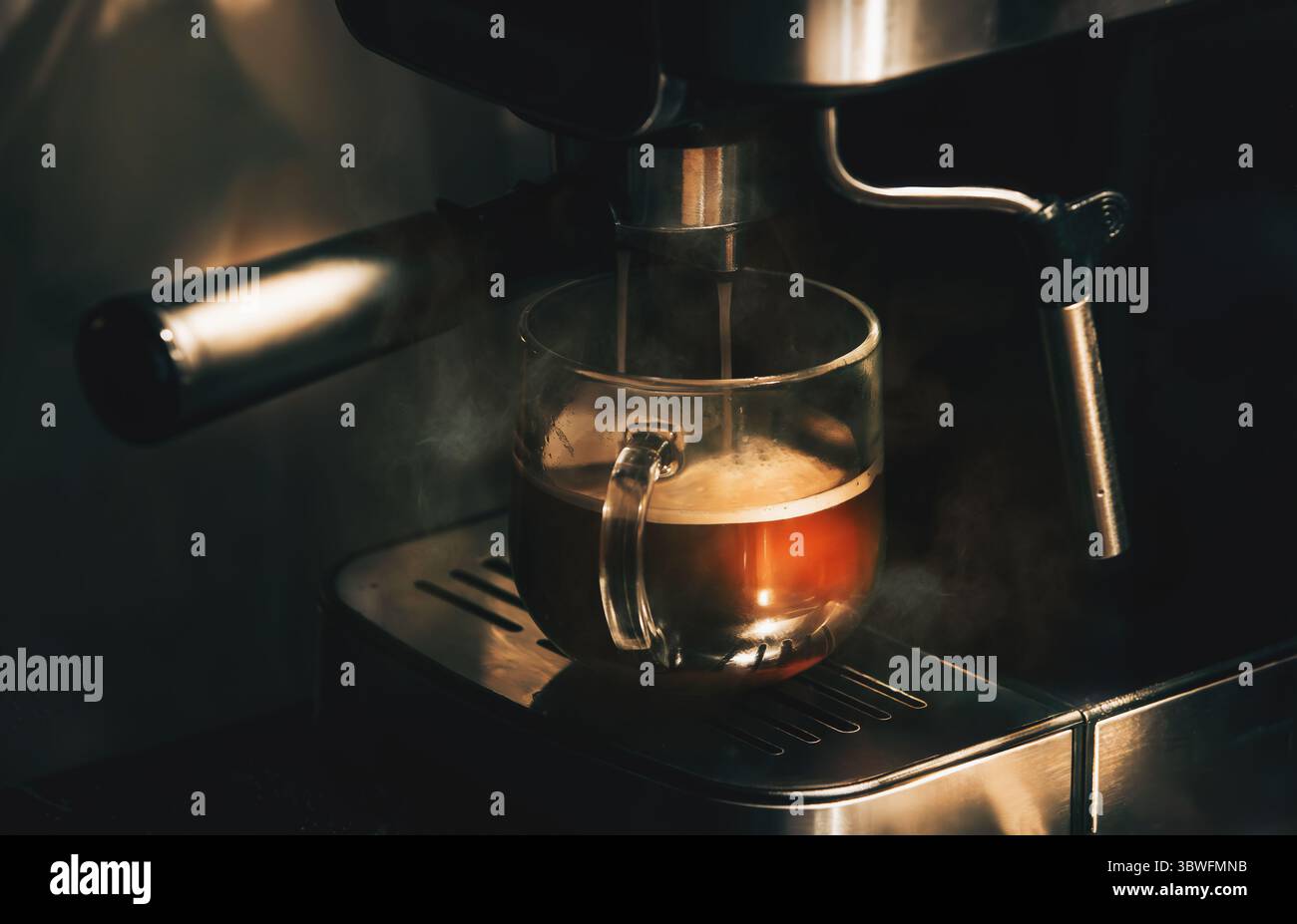 Making delicious morning coffee in a coffee machine Stock Photo