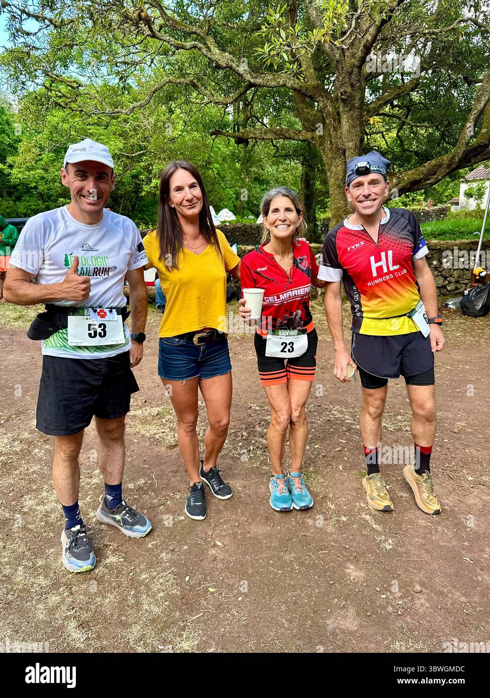 Group of runners smiling after a Backyard Ultra competition in the Azores, Portugal - Smartphone Captured Stock Image