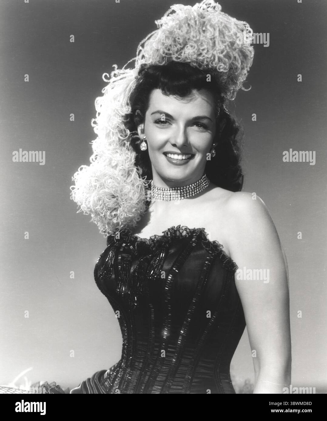 Jane Russell Posed in Black Silk Corset Dress and White Boa Headdress  (Credit Image:  Movie Star News via ZUMA Press Wire Service Stock Photo -  Alamy