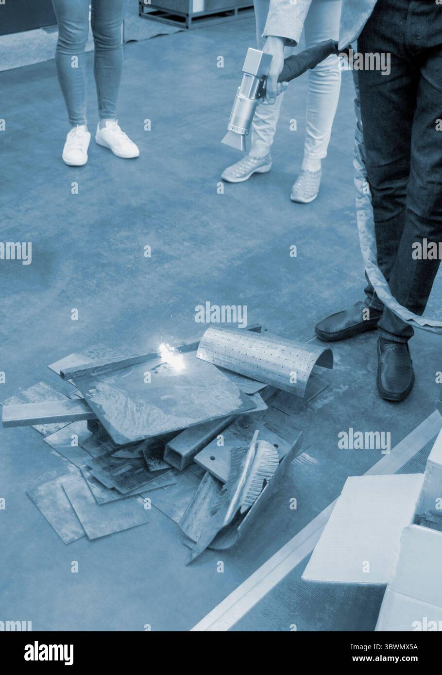 Person cleaning metal surface from rust with laser. Laser cleaning ...