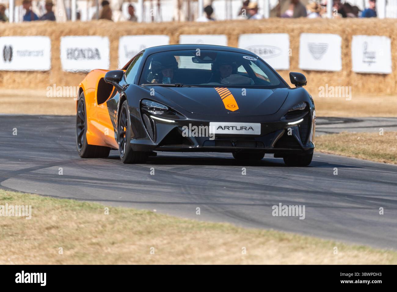 McLaren Artura Coupe Hybrid Electric Sports Car Driving Up The Mclaren Artura Coupe Hybrid Electric Sports Car Driving Up The Hillclimb Track At The Goodwood Festival Of Speed 2025 Motorsport Event 3BWPDH3