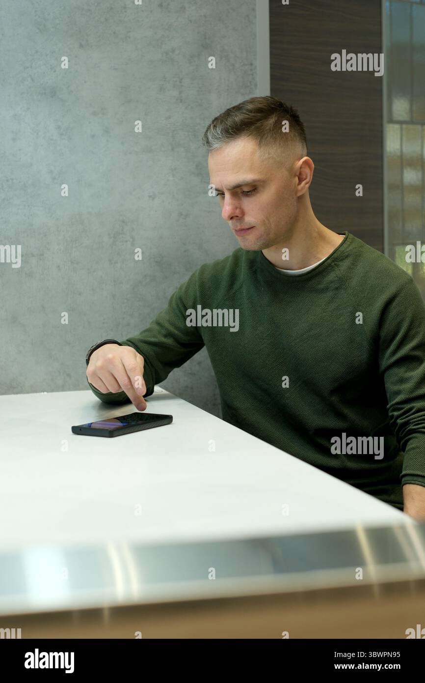Man seated sleek table focused hi-res stock photography and images - Alamy