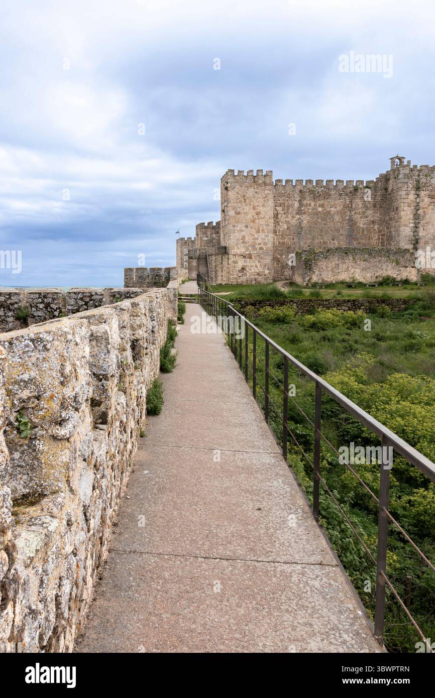 Castle Railing Torret Narrow pathway with railing leading towards imposing medieval castle ...