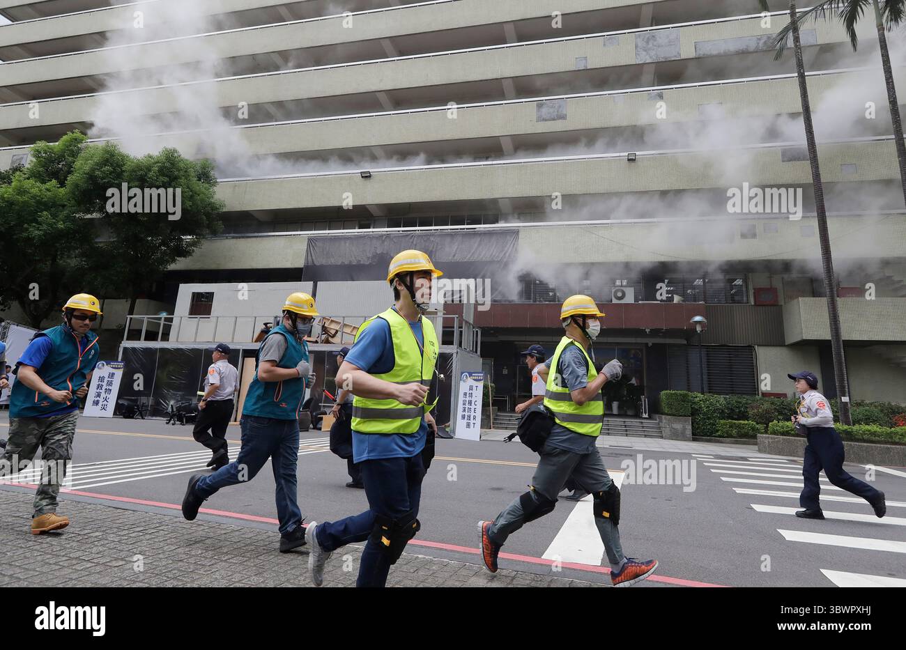 People take part in an air raid drill in Taipei, Taiwan, Thursday, July ...