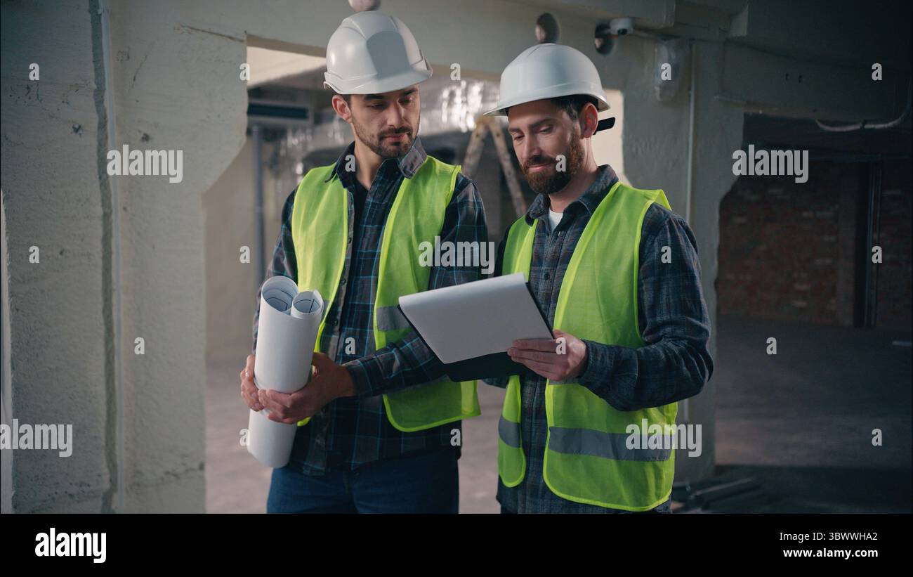 Caucasian two people men architects engineers guys males builders in ...