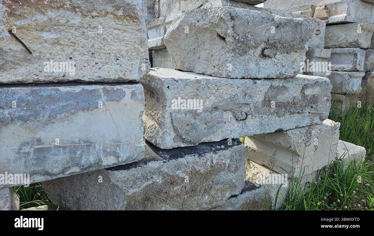Abandoned Concrete Blocks in Overgrown Industrial Site - Smartphone Captured Stock Image