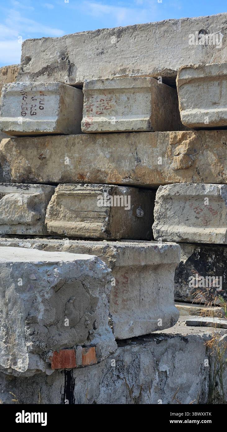 Abandoned Concrete Blocks in Overgrown Industrial Site - Smartphone Captured Stock Image