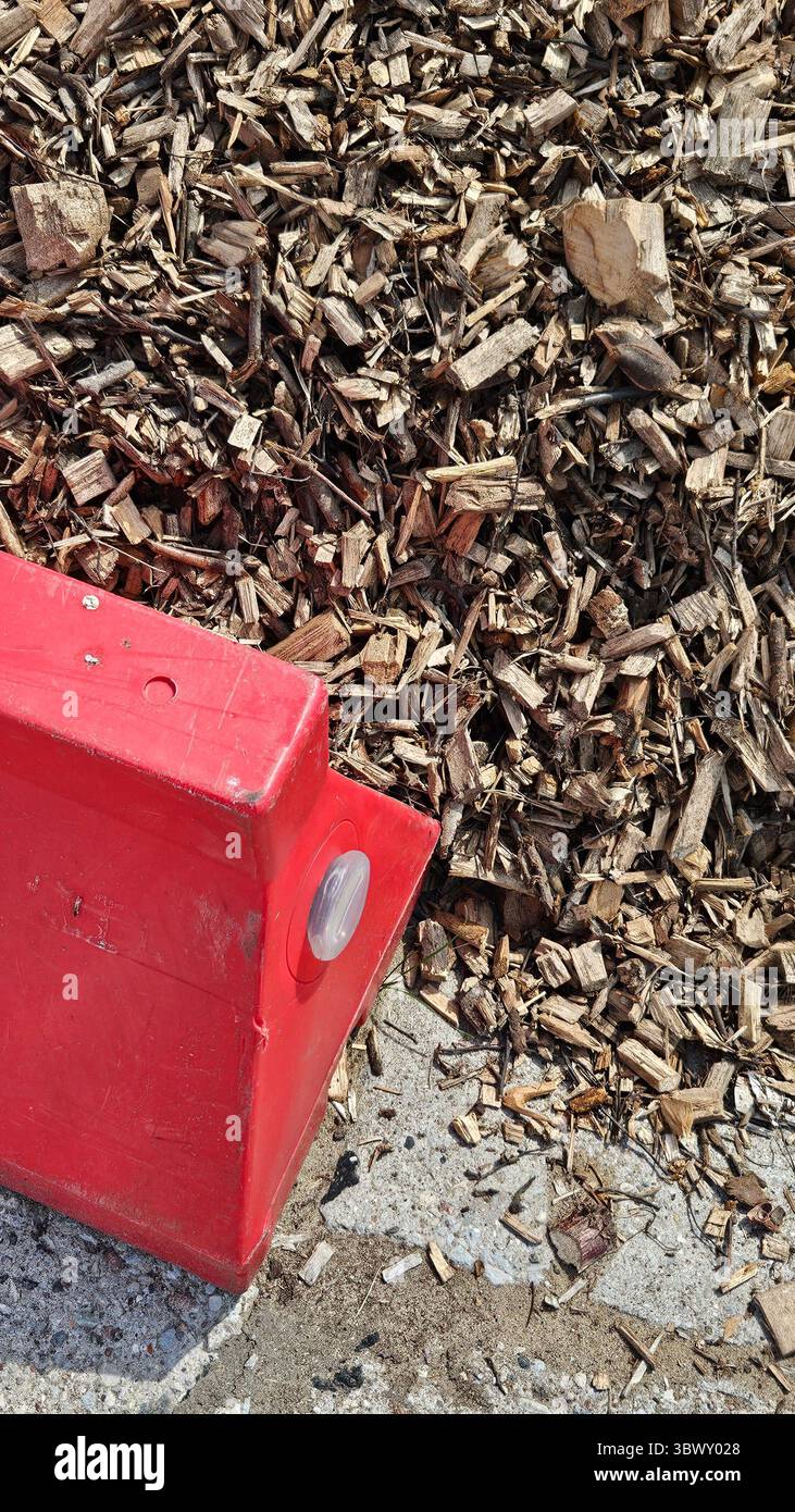 Wood Chips and Red Barrier - Smartphone Captured Stock Image