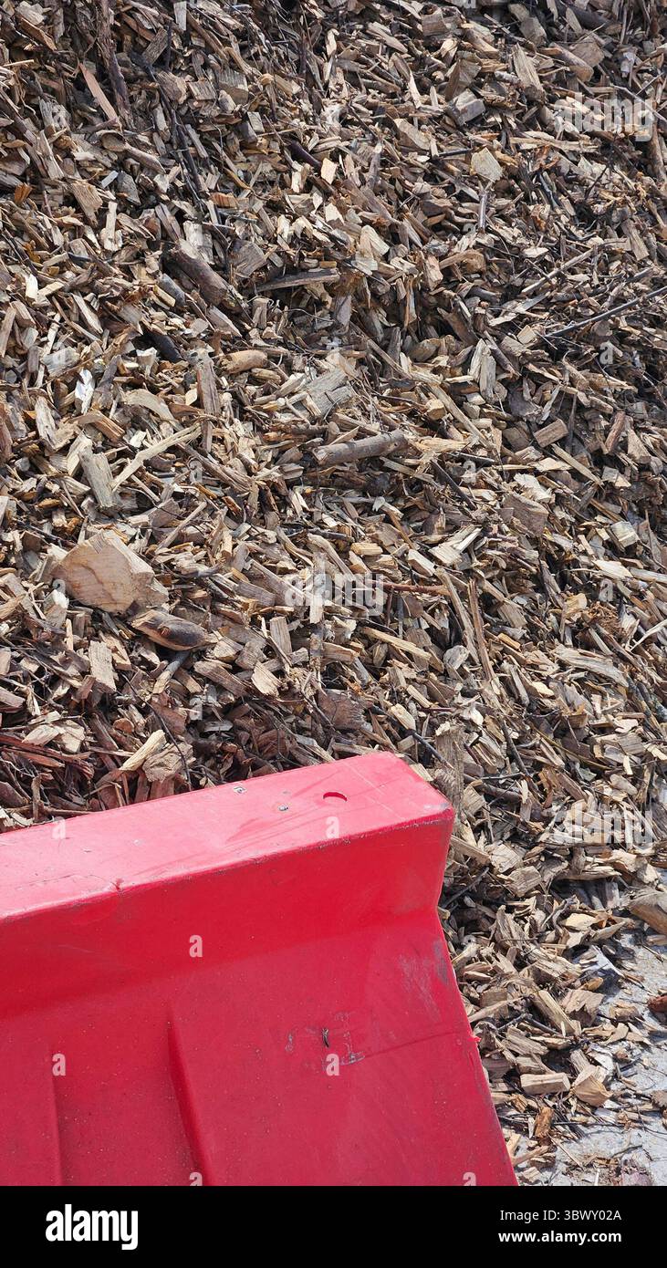 Wood Chips and Red Barrier - Smartphone Captured Stock Image