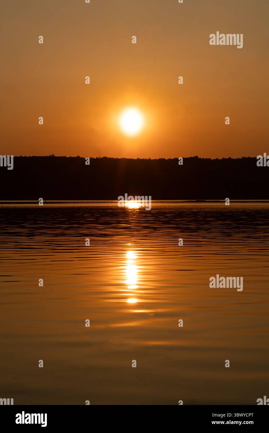 Sunset over a river Stock Photo