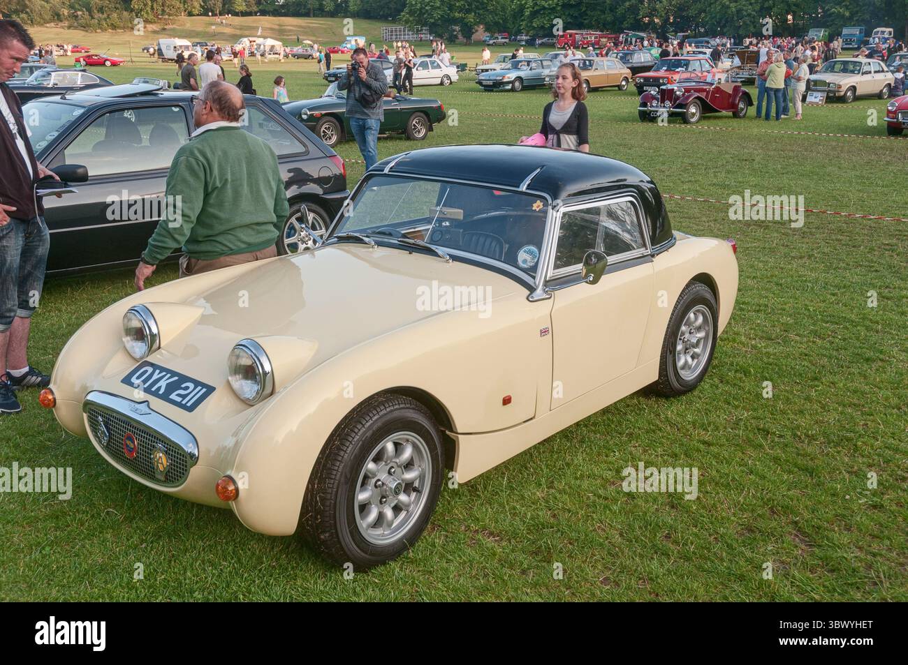a-yellow-austin-healey-frogeye-supersprite-car-at-a-classic-vehicle