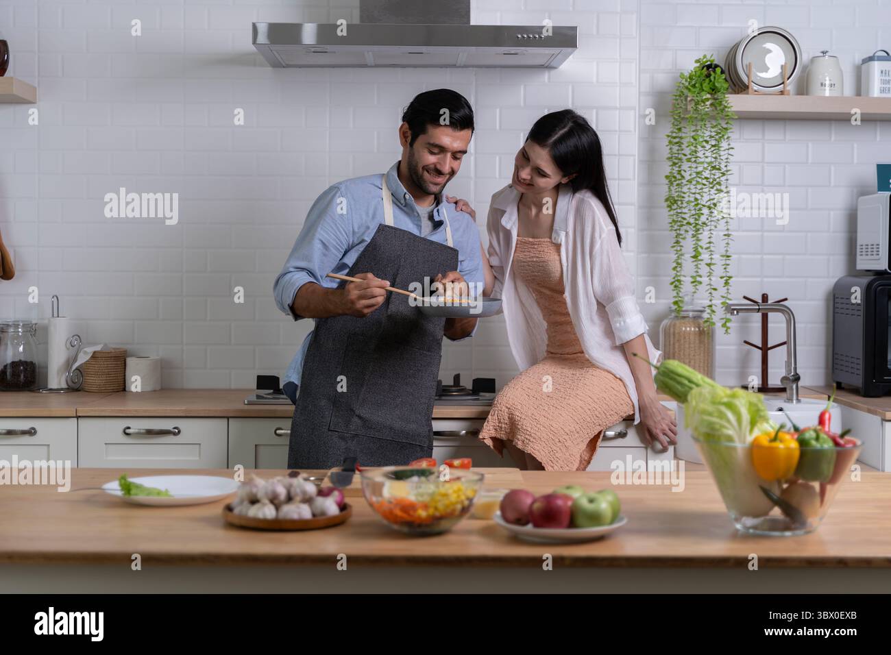 Man enjoying fruits in kitchen hi-res stock photography and images - Alamy