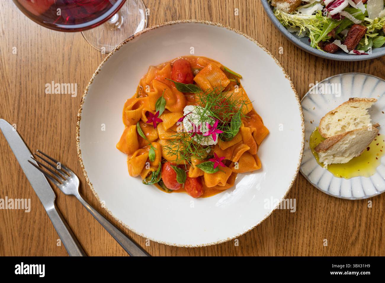 Gourmet pappardelle pasta with rich tomato sauce, fresh herbs, and ... - Gourmet Pasta Assembly For Visually Stunning Fine Dining