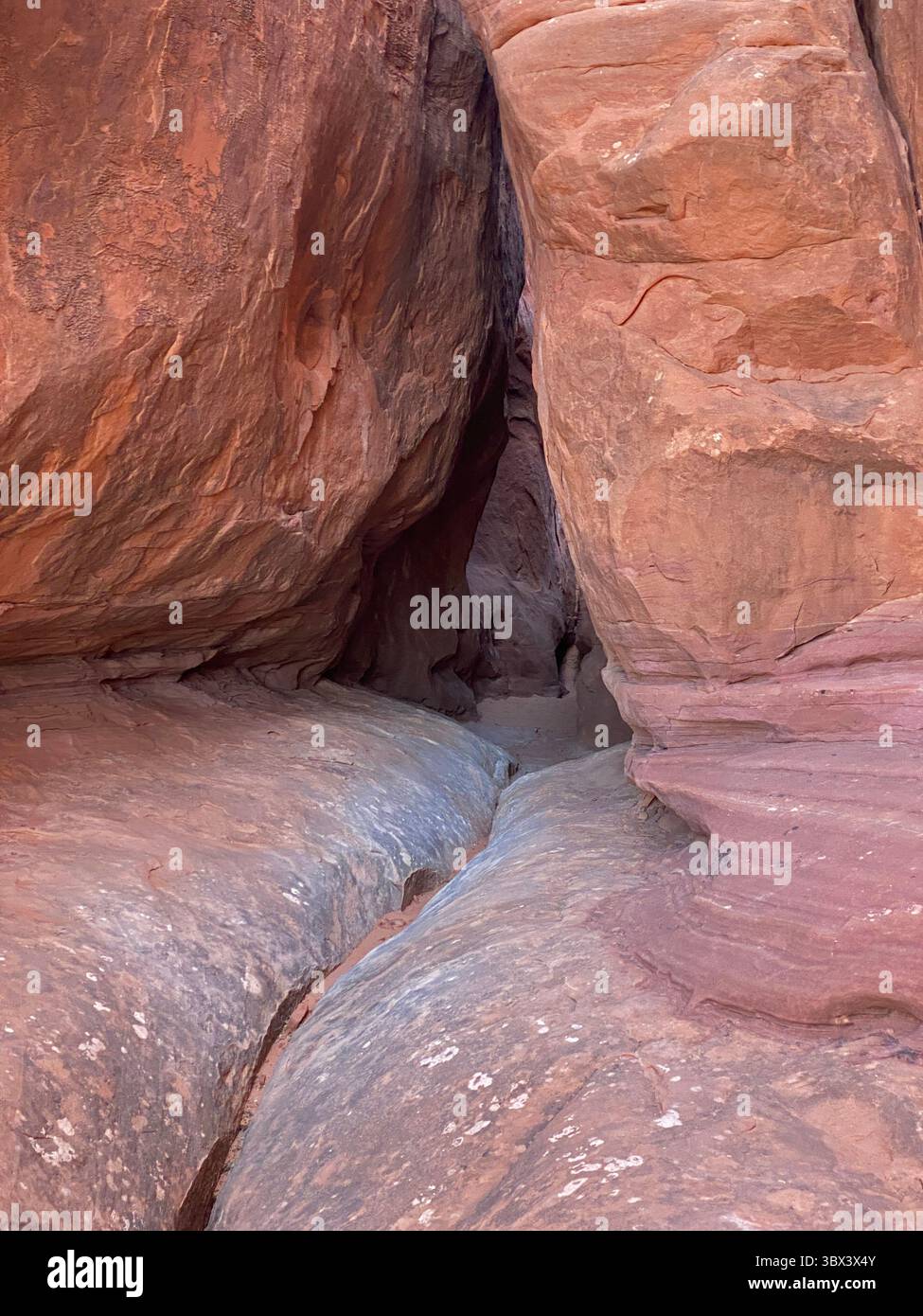 A slot canyon, made of red sandstone, on the Fiery Furnace Trail in Arches National Park, Moab, Utah, USA - Smartphone Captured Stock Image