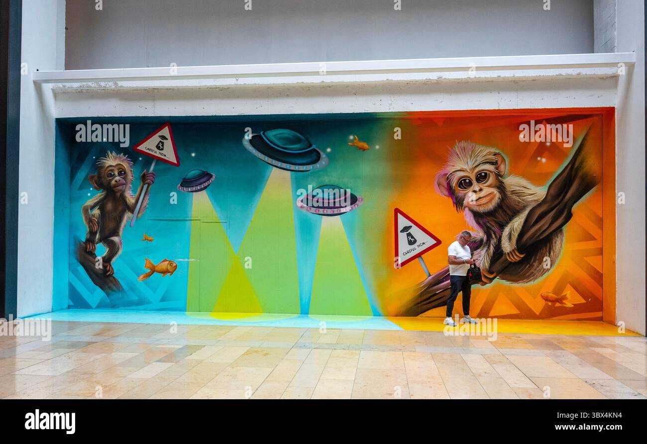 Peterbrough shopping center 17th July 2025;  movie star Paddingtington bear is one of the paintings,  Artists transformed vacant shop fronts into stunning mural.s  Cliff Norton Alamy live news Stock Photo