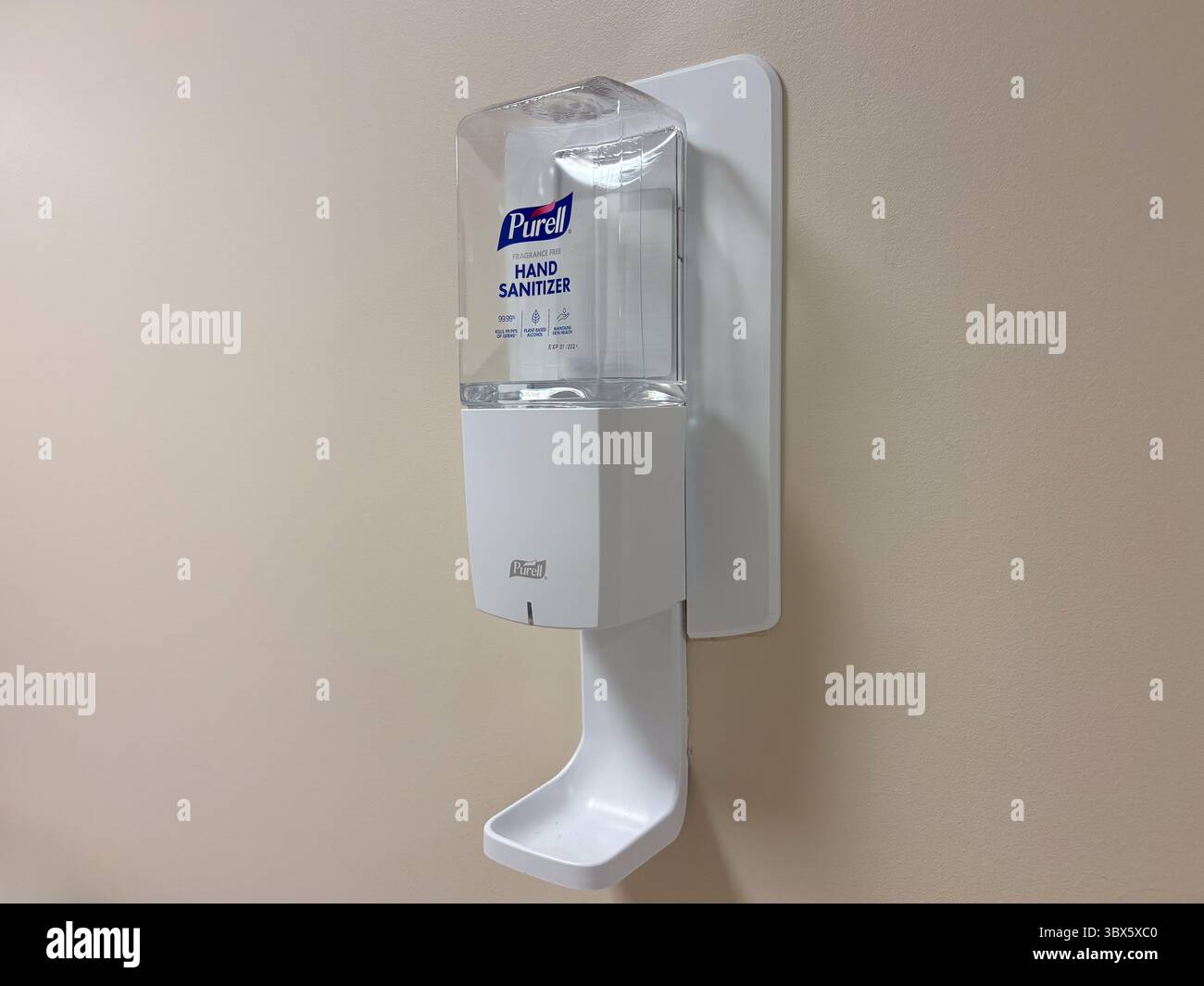 Wall-Mounted Purell Hand Sanitizer Dispenser Isolated Stock Photo - Alamy