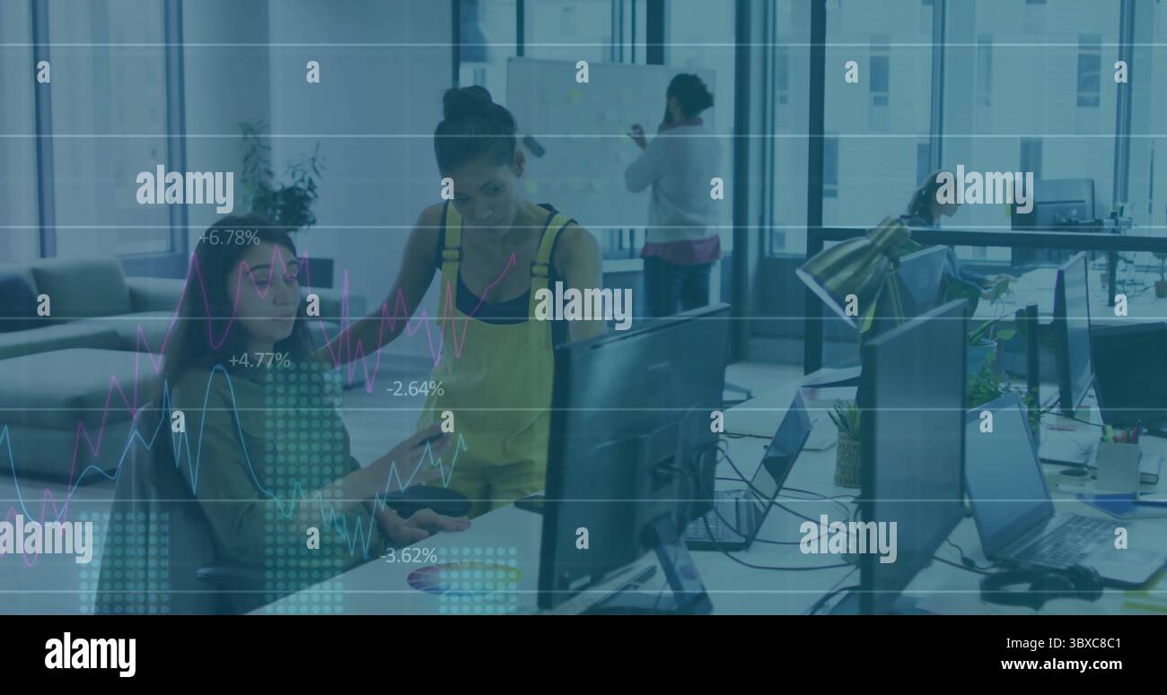 Pointing woman seated coworker hi-res stock photography and images - Alamy