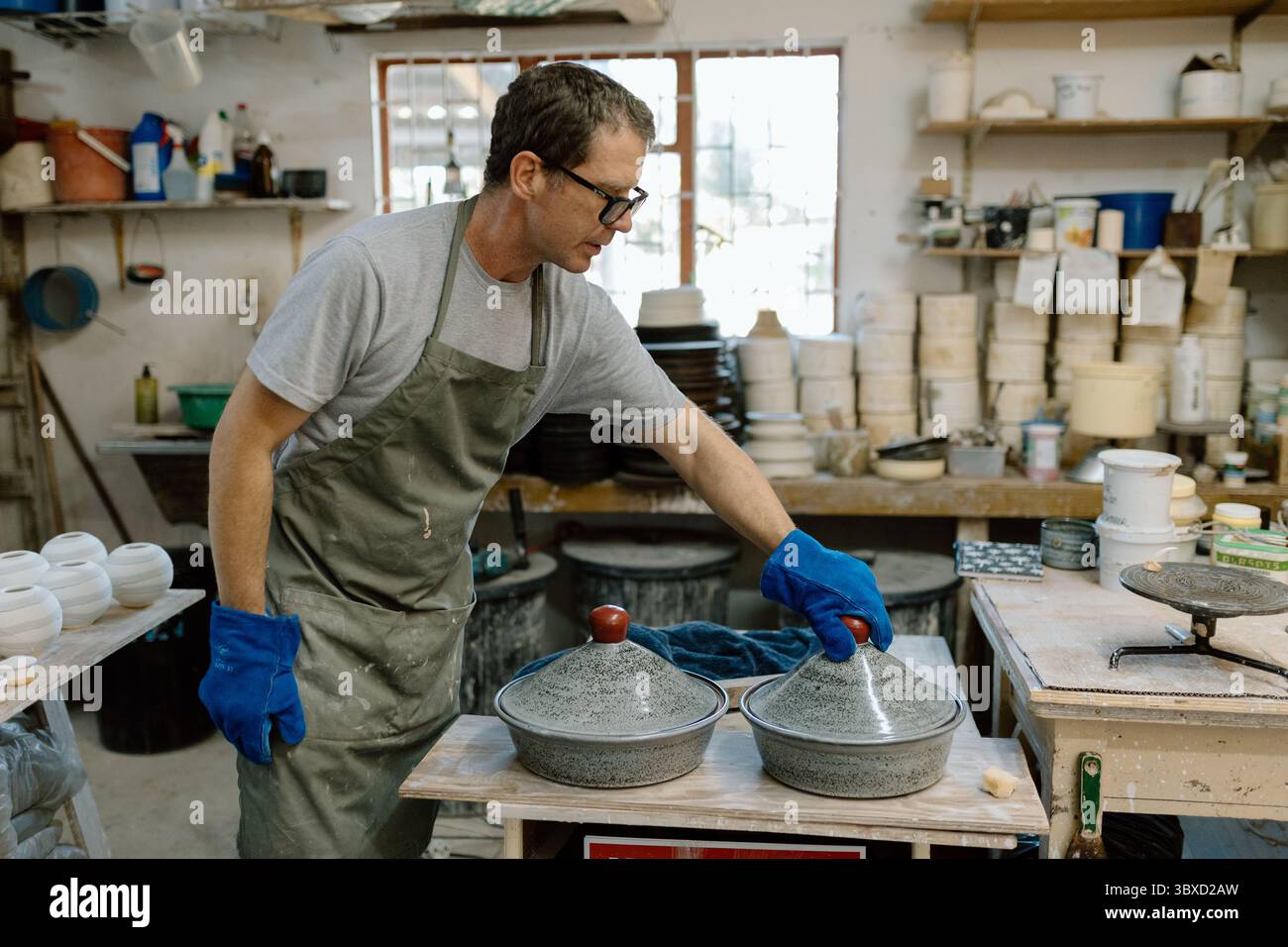Artist in Ceramics and Pottery Studio working Stock Photo - Alamy