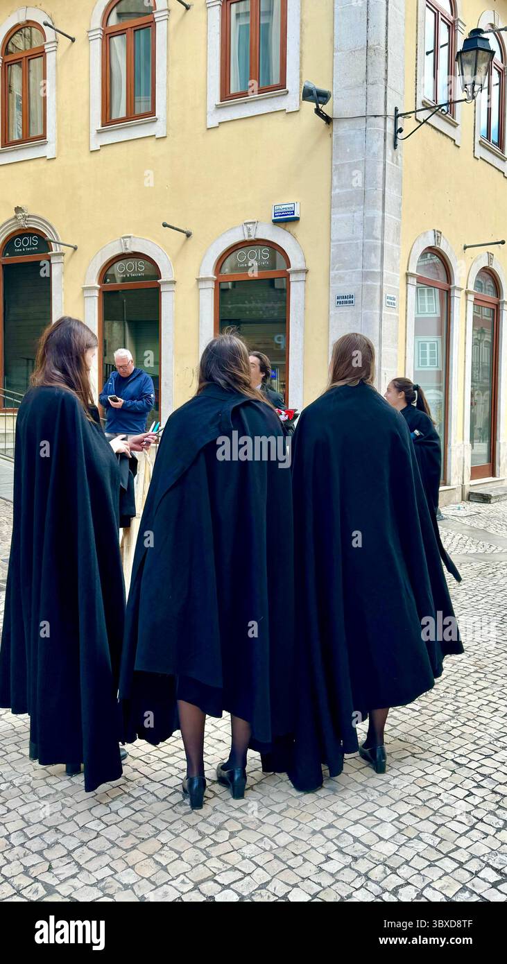 University of Coimbra students wearing capa e batina robes in Coimbra Portugal - Smartphone Captured Stock Image