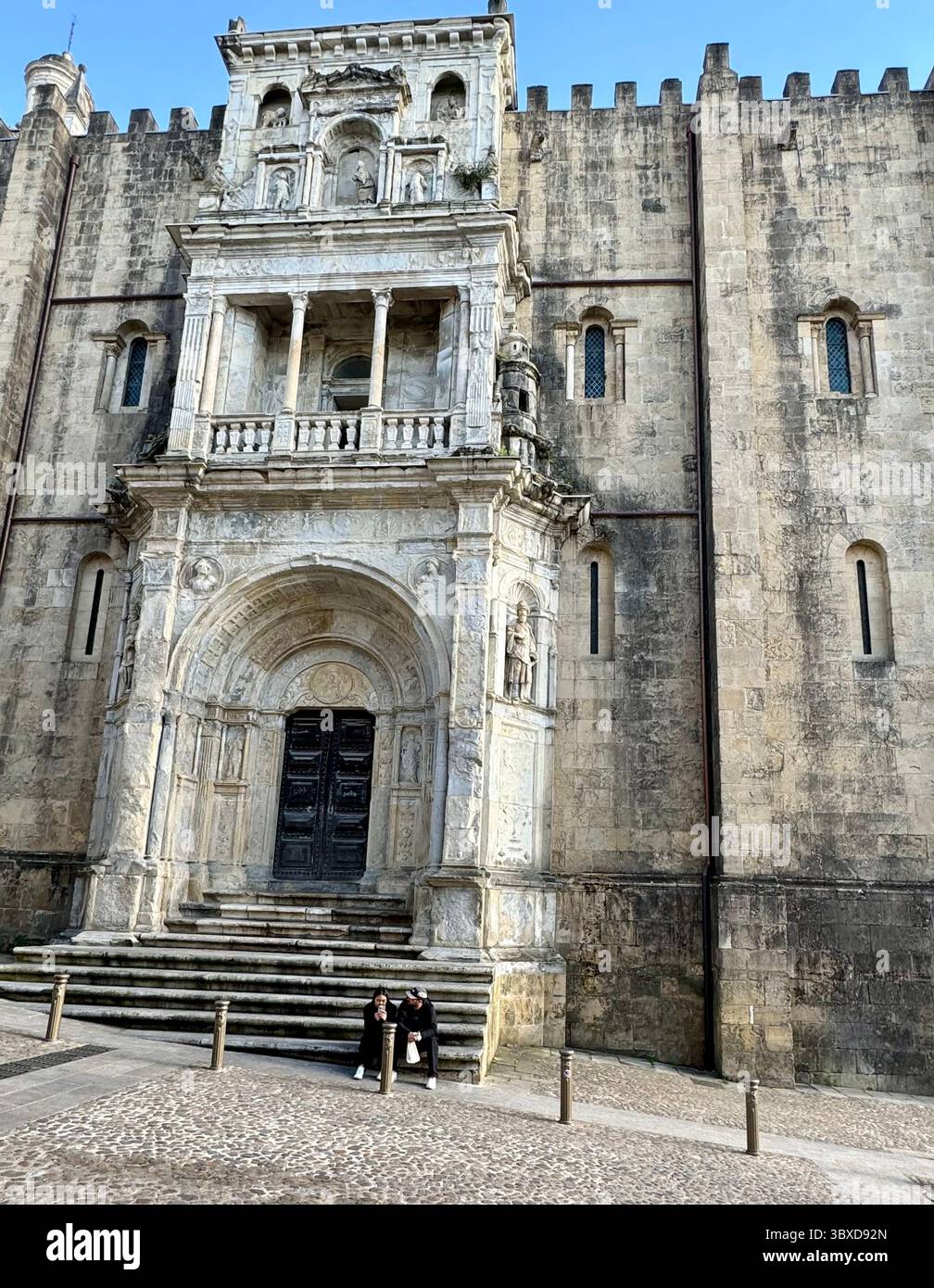 North facade of Romanesque Old Cathedral of Coimbra with Renaissance-style portal called the Porta Especiosa - Smartphone Captured Stock Image