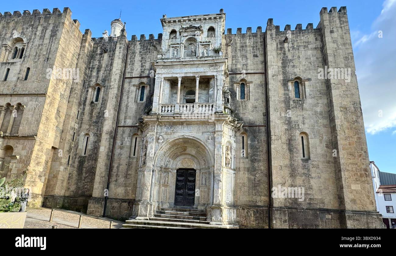 North facade of Romanesque Old Cathedral of Coimbra with Renaissance-style portal called the Porta Especiosa - Smartphone Captured Stock Image