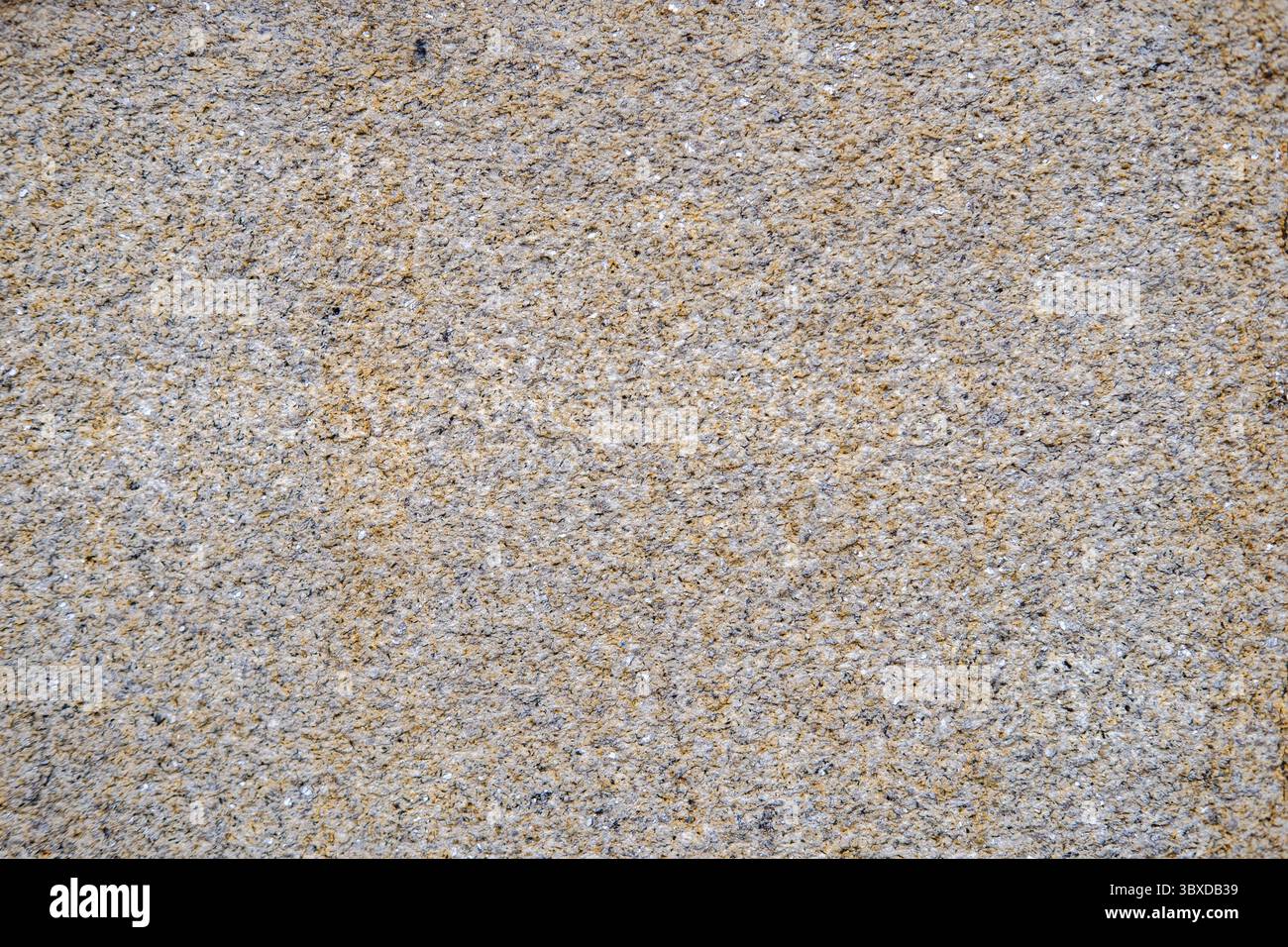rough granite stone wall texture as a natural architectural background Stock Photo
