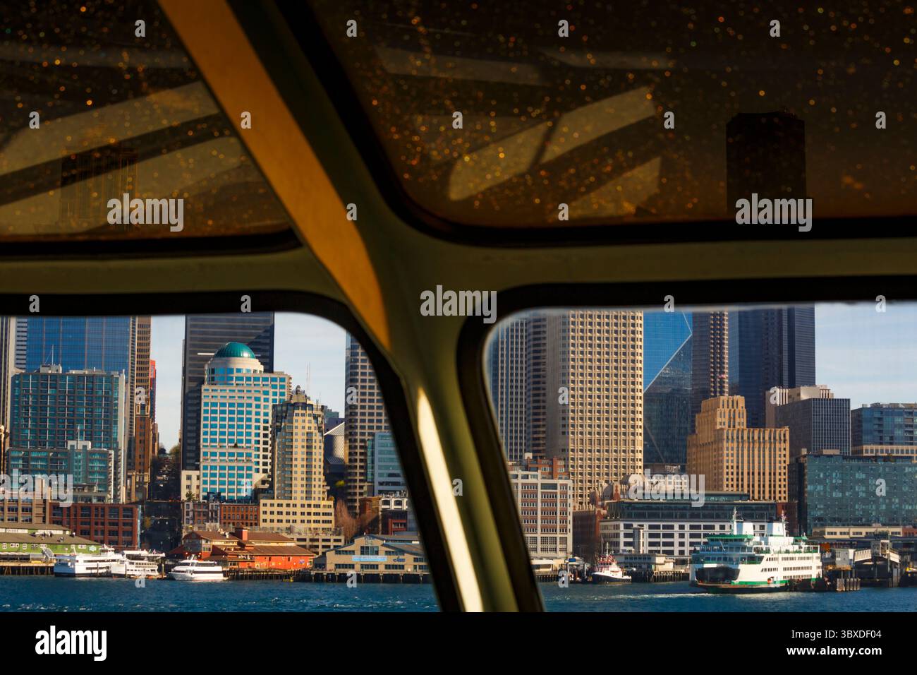 Big Wheel and Downtown Seattle views from a Puget Sound ferry window, Seattle. Stock Photo