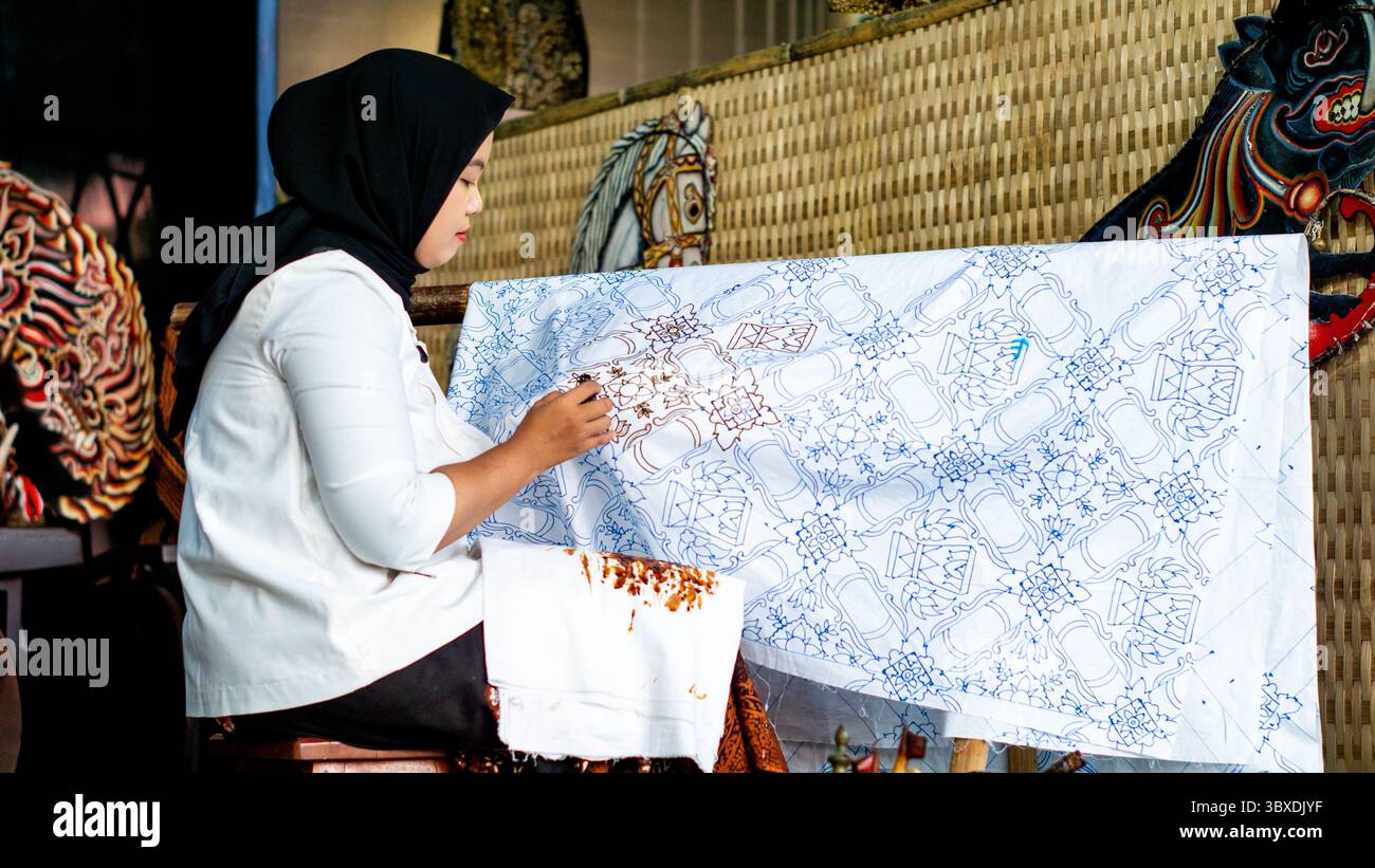 The process of making batik cloth. Batik is a type of cloth whose ...