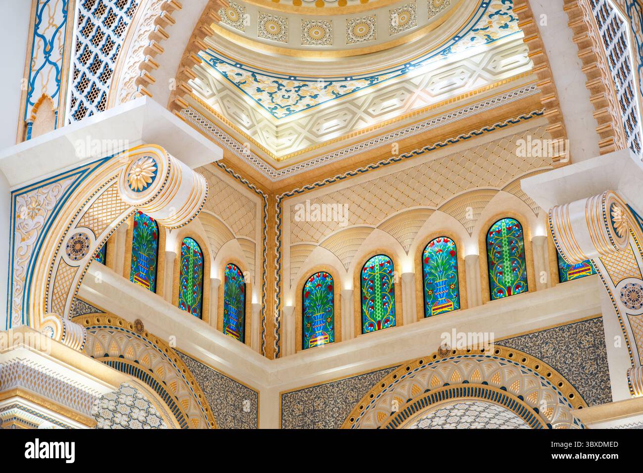 Intricate architectural ceiling with stained glass windows and ornate patterns in beige and blue tones. Stock Photo