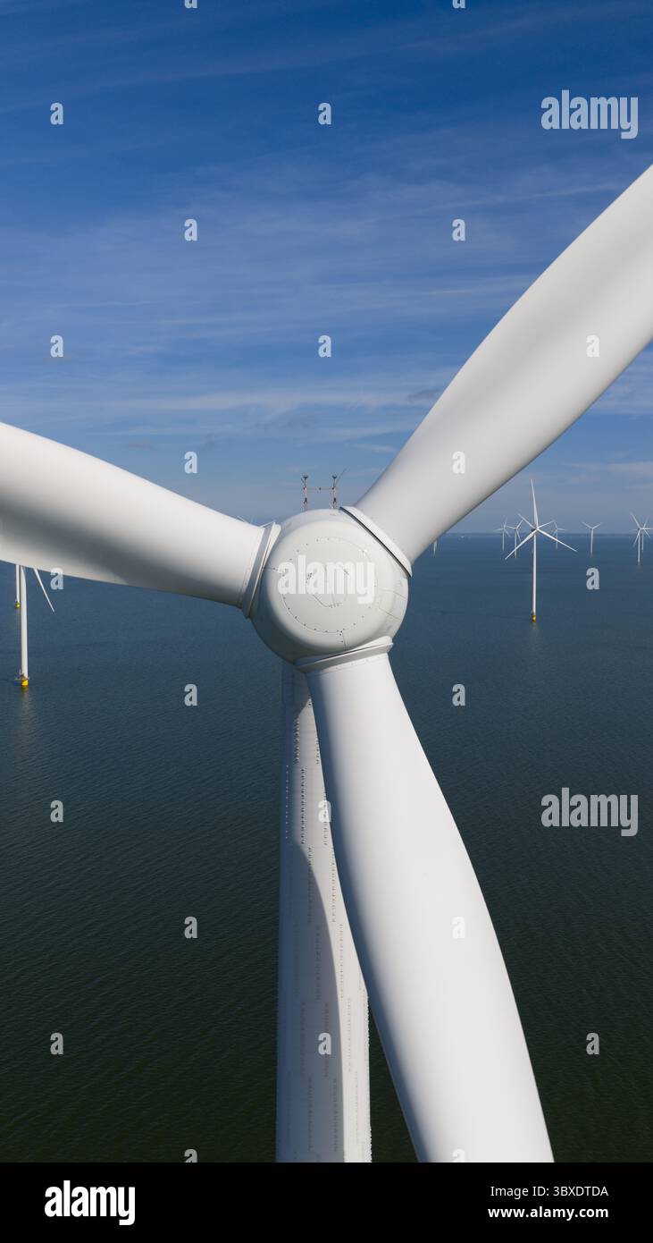 Offshore Rotor Sign Offshore wind turbine fixed foundation, rotor, blades. Aerial drone ...