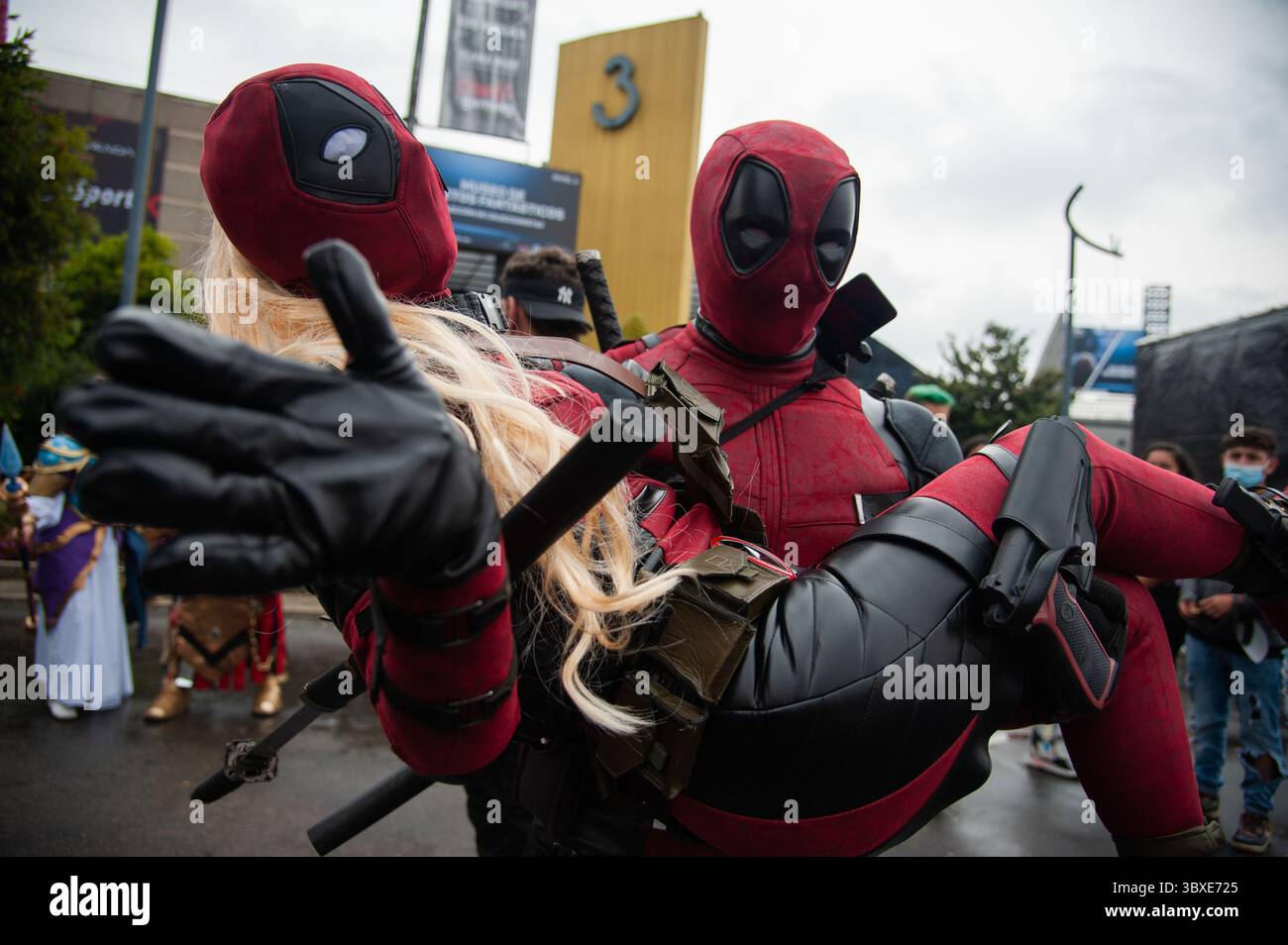 A couple dressed as Deadpool pose for a photo during the first day of the  SOFA (Salon del Ocio y la Fantasia) 2021, a fair aimed to the geek audience  in Colombia that mixes Cosplay, gaming, superhero and movie fans from  across Colombia, in Bogota ..., image size:1300x954