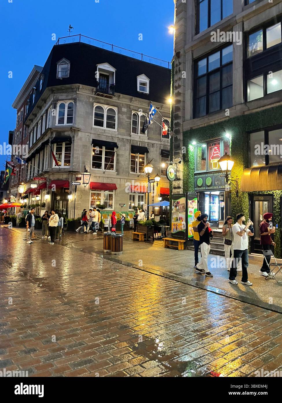 People enjoy a summer evening walking around the cafes and shops of Old ...