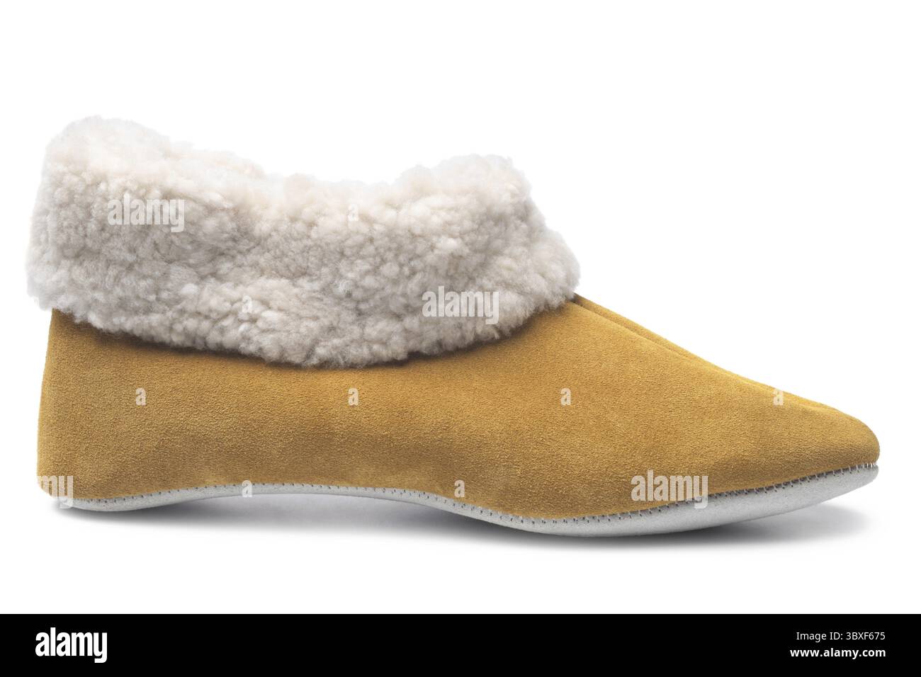 Handcrafted leather slipper with wool lining on white background Stock Photo