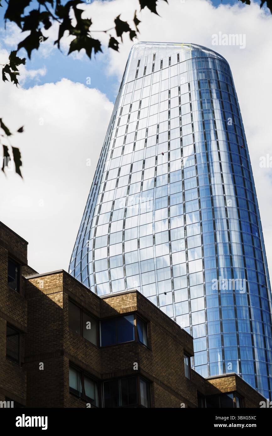 Old building against a new skyscraper in the city Stock Photo - Alamy
