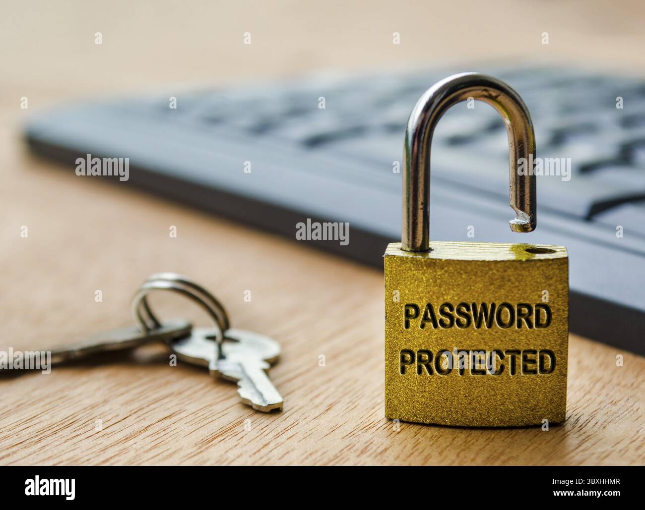 Password protected text engraved on padlock with keyboard background. Password security concept Stock Photo