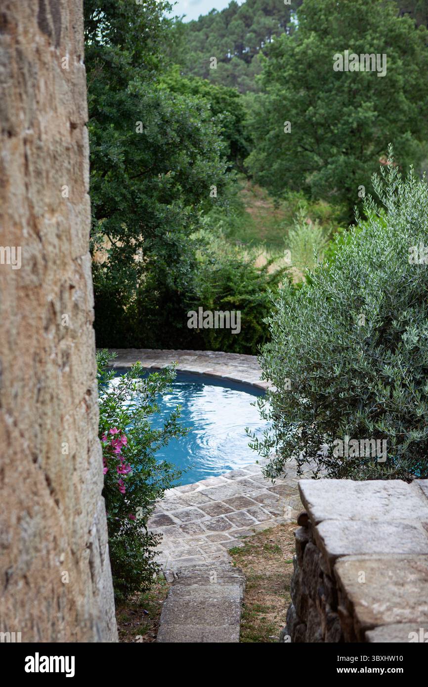 Round swimming pool in the park Stock Photo
