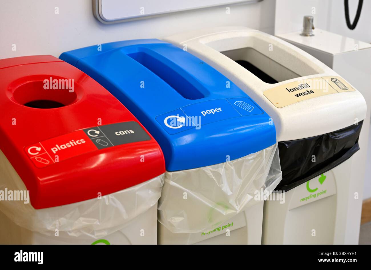 Recycling and rubbish bins used inside building Stock Photo