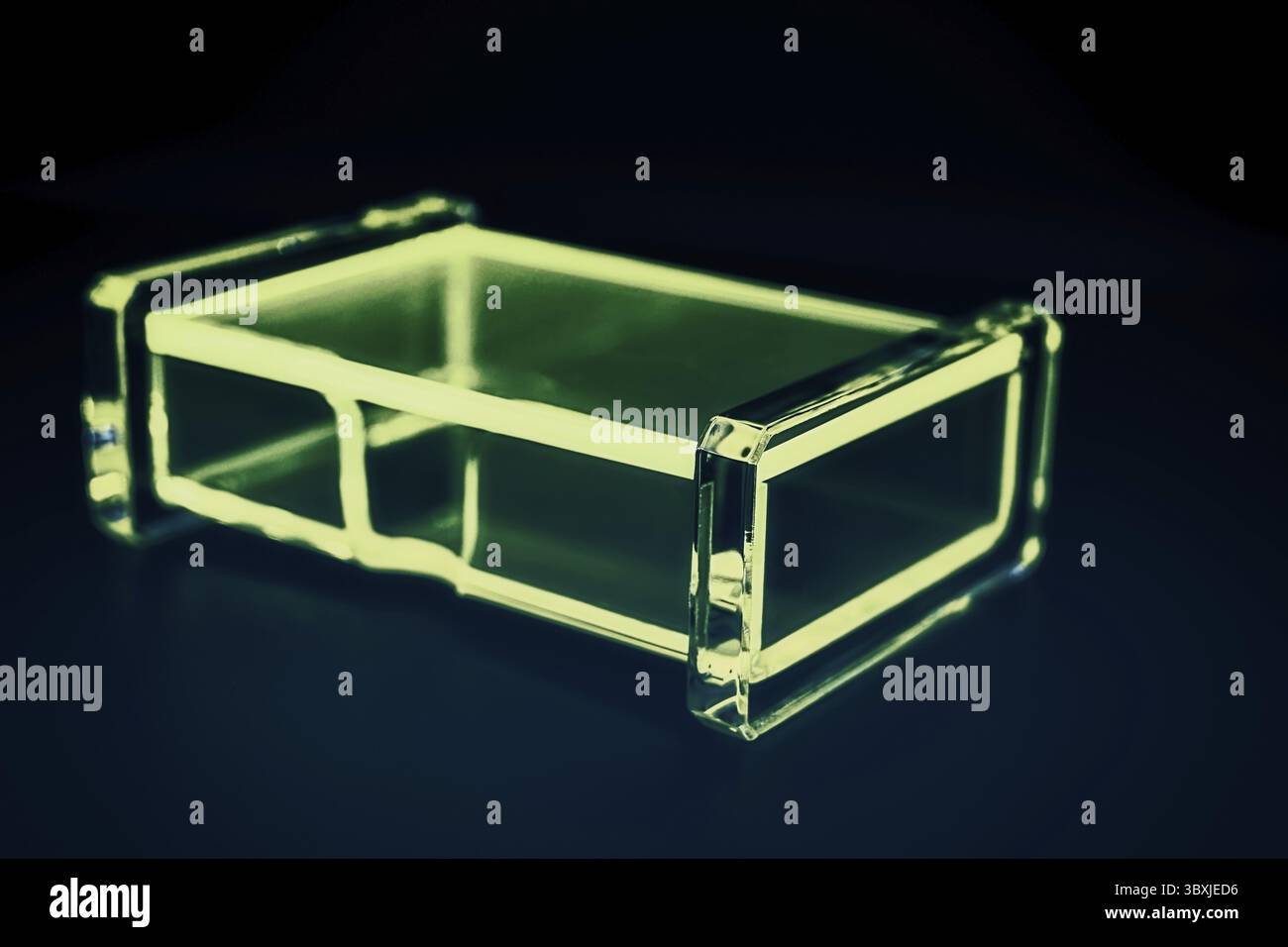Abstract transparent plastic box dark background Stock Photo