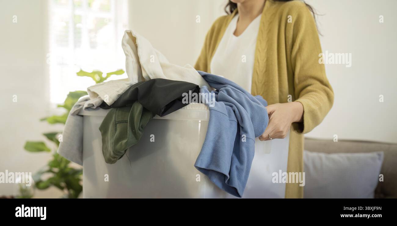 Helping Objects Donation, asian young woman sitting pack object at home, putting on ...