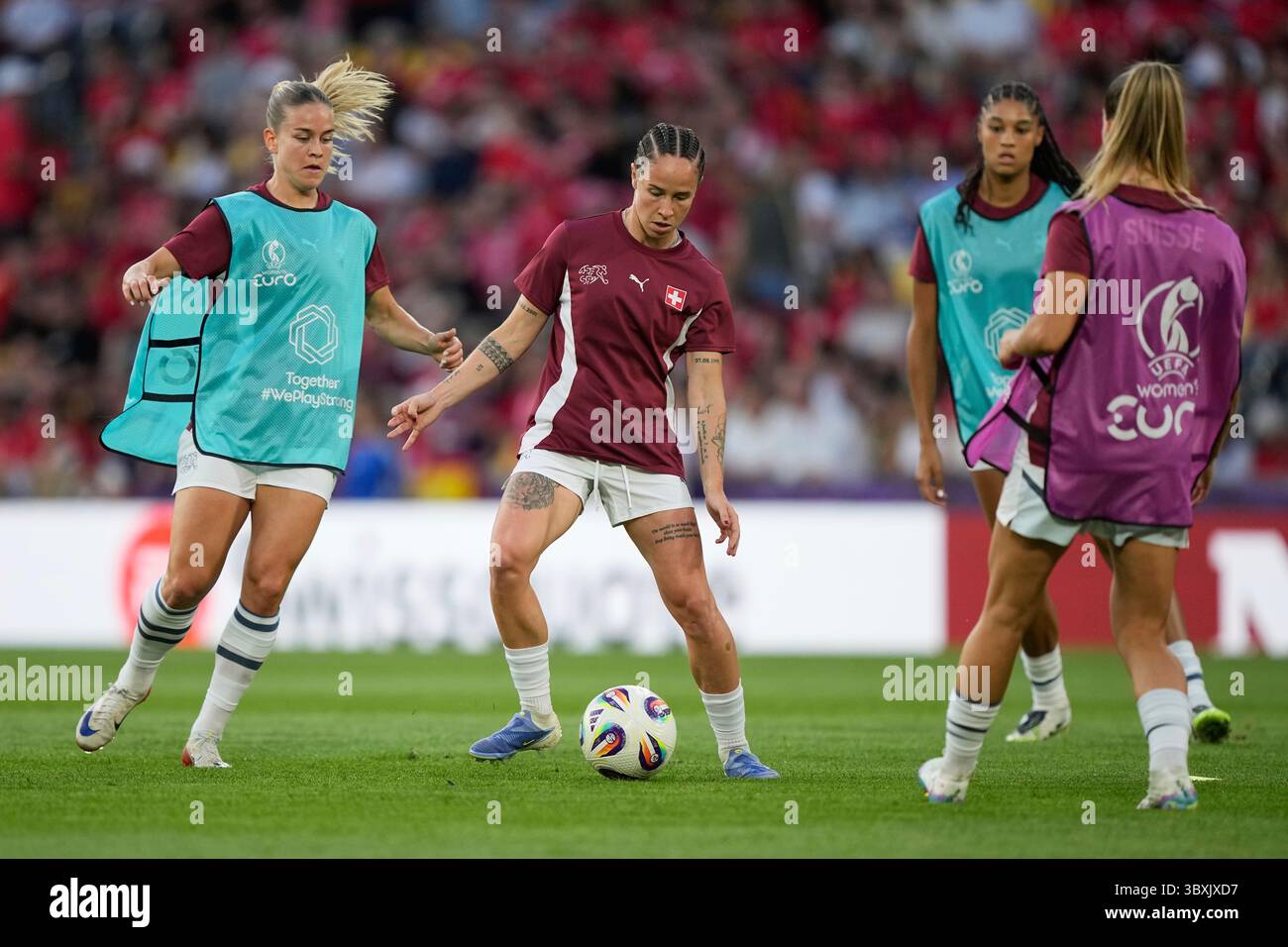 Switzerland’s Geraldine Reuteler, centre, warms up prior to the Women’s