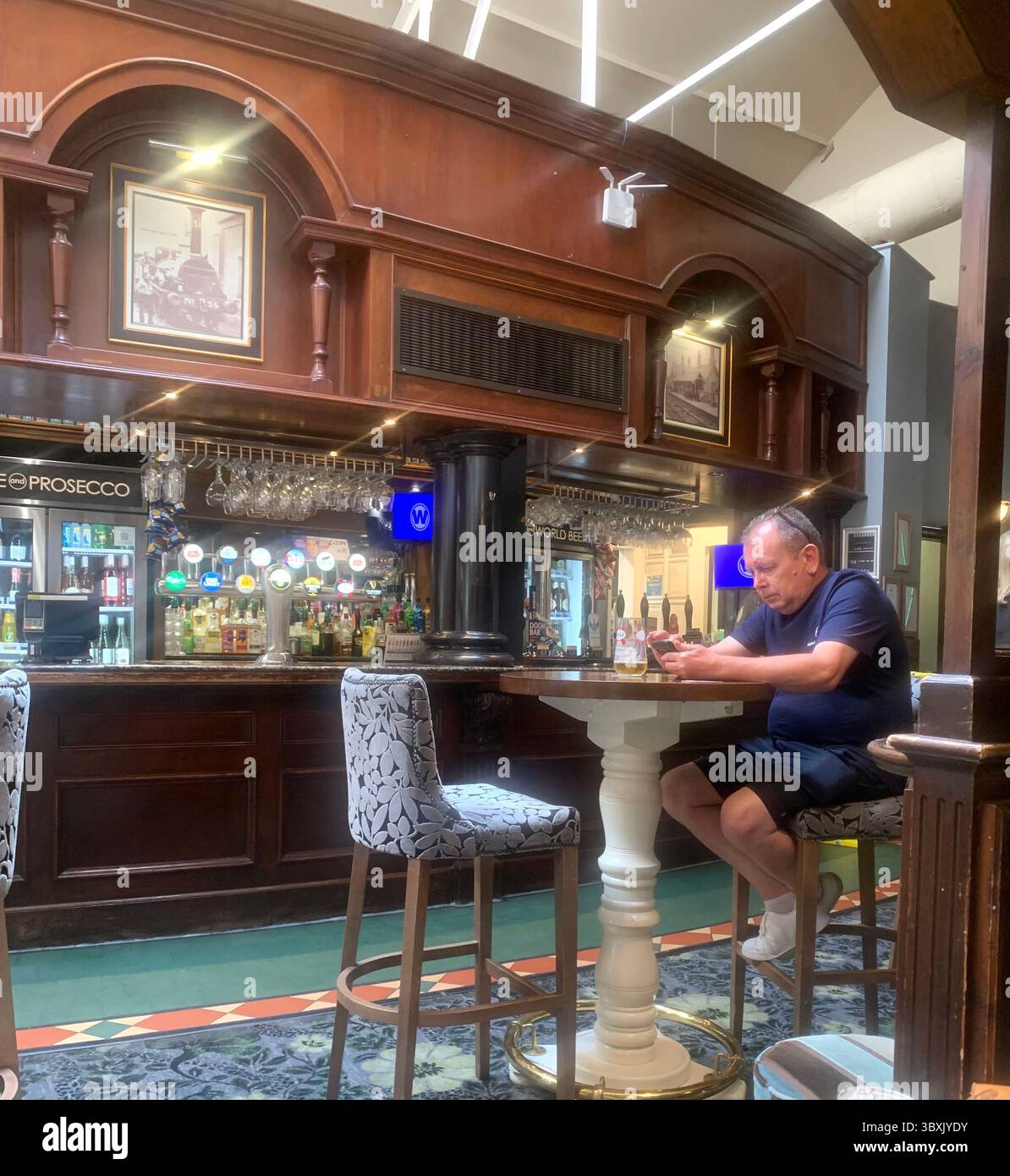 Market  Harborough Northamptonshire UK Town Village place pub bar shop shops shopping outside holidays holiday walking walk plants old Naseby - Smartphone Captured Stock Image