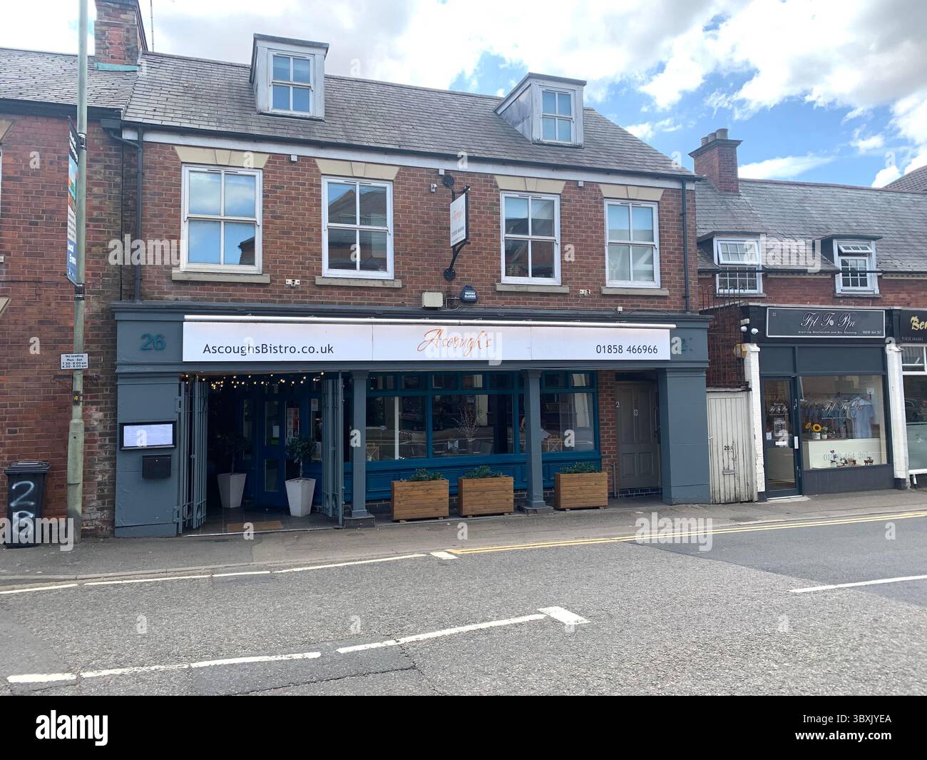 Market  Harborough Northamptonshire UK Town Village place pub bar shop shops shopping outside holidays holiday walking walk plants old Naseby - Smartphone Captured Stock Image