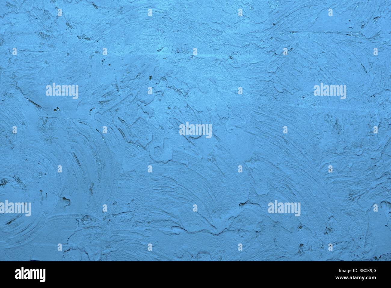 Blue background made with a texture of a plaster wall Stock Photo